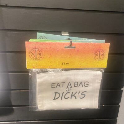 White zippered canvas pouch with bold black lettering that says “EAT A BAG OF DICK’S.” Packaged with a bold orange and pink Trashmagick Alchemy header card marked $6.