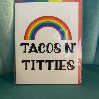 Meta Tag “Tacos N’ Titties” Pride Greeting Card – funny LGBTQ+ rainbow card. Perfect for Pride, birthdays, or gifting with humor and color.