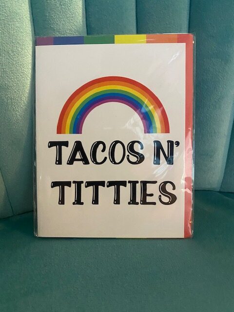 Meta Tag “Tacos N’ Titties” Pride Greeting Card – funny LGBTQ+ rainbow card. Perfect for Pride, birthdays, or gifting with humor and color.