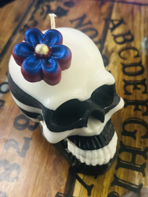 Custom Flower Skull Candles by Trashmagick Alchemy. Handmade with endless options: glitter, color-changing wax, layered colors, bold scents & unique designs.