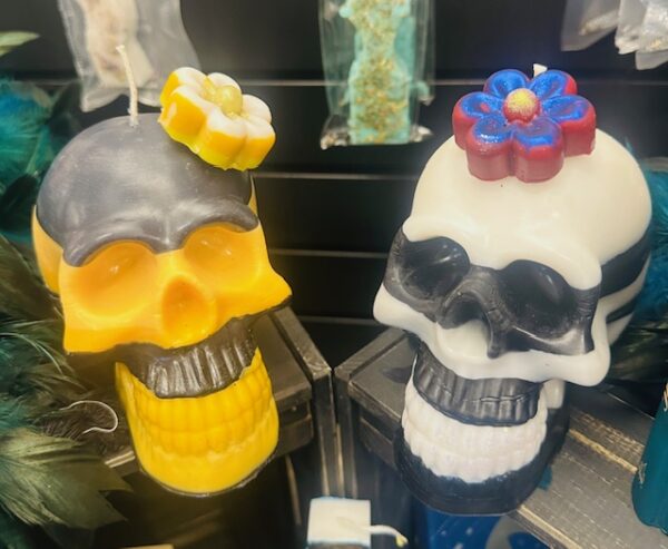 Custom Flower Skull Candles by Trashmagick Alchemy. Handmade with endless options: glitter, color-changing wax, layered colors, bold scents & unique designs.