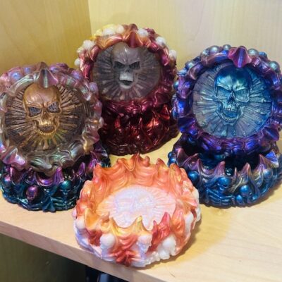 Handmade resin skull holders and steampunk gear ashtrays from Trashmagick Alchemy. Gothic, custom resin art with flames, skulls, gears & metallic shimmer.